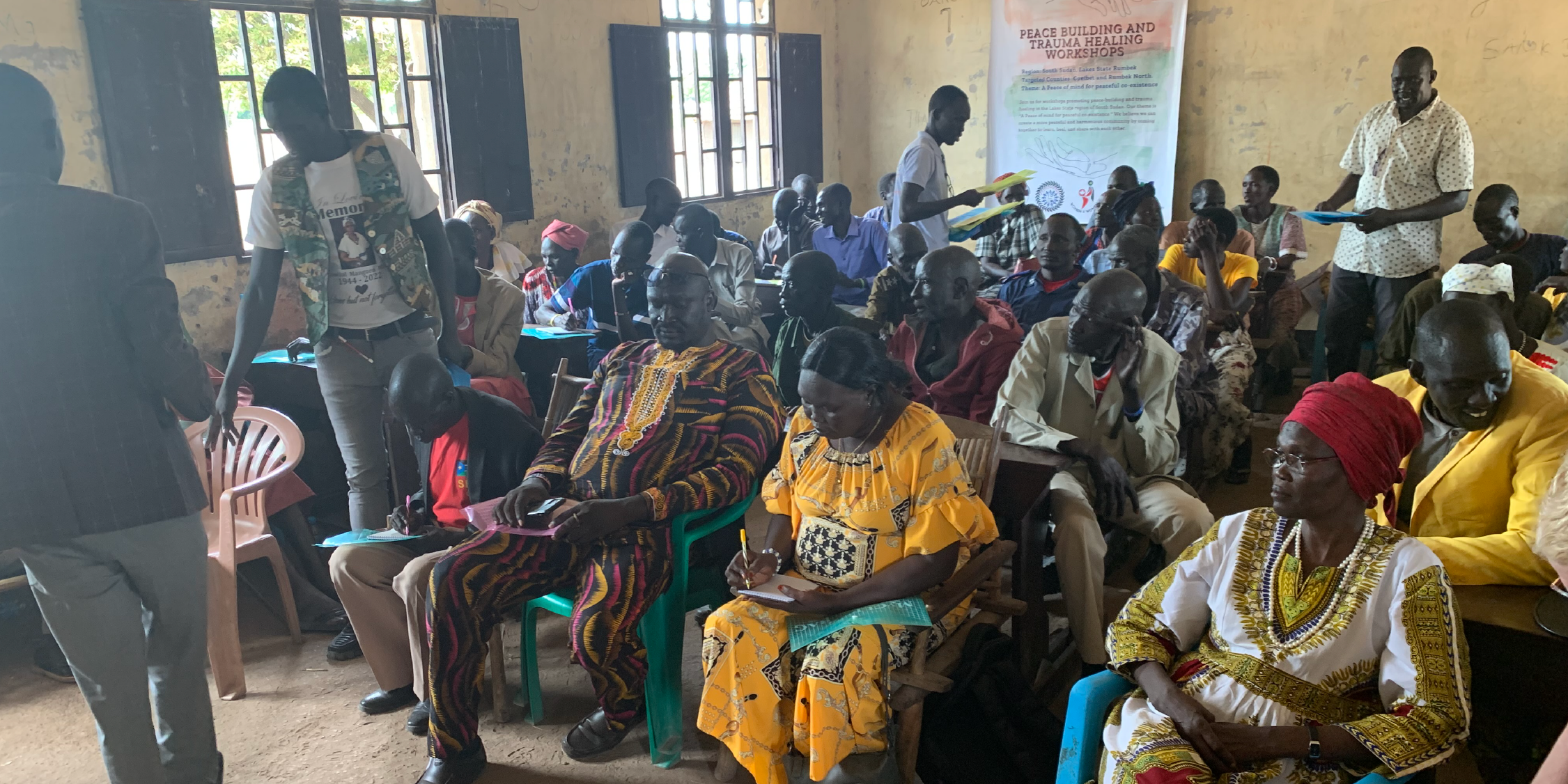 A group is gathered for a trauma and healing training session led by a local organization in partnership with MW4WSS in Cueibet County, Lake State, South Sudan.
